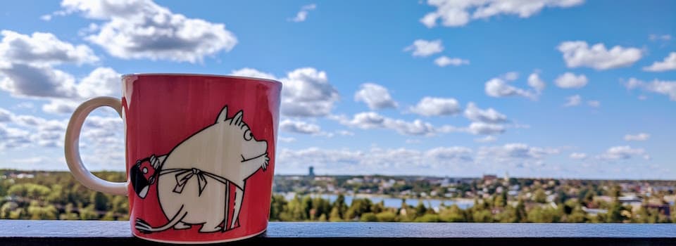 Mug inspired by Moomin books, placed outdoors